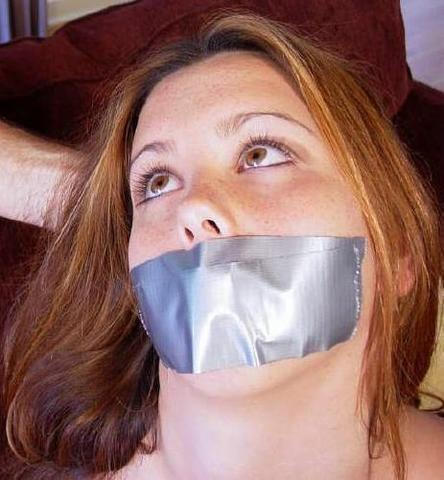 Woman with her lips duct taped shut