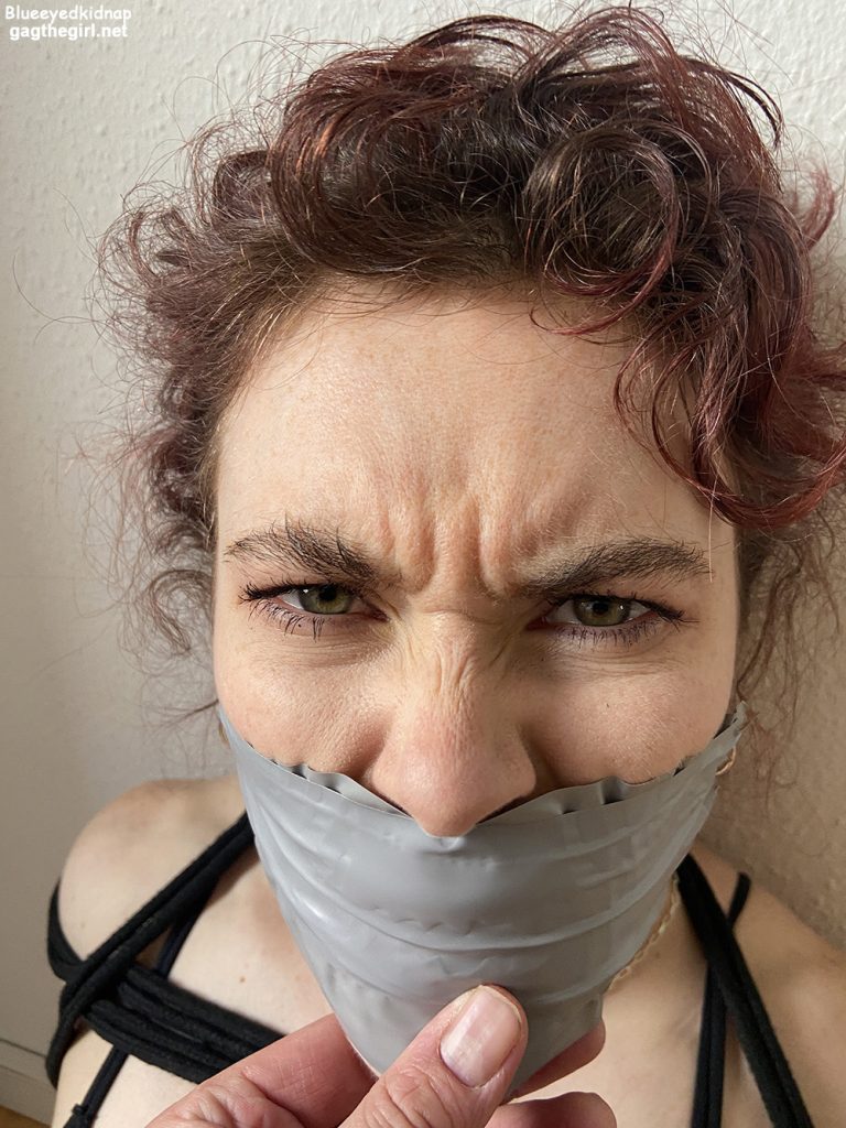 Pissed woman gagged with tape