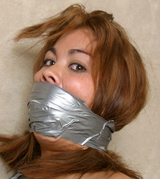 Tape wrap gagged brunette